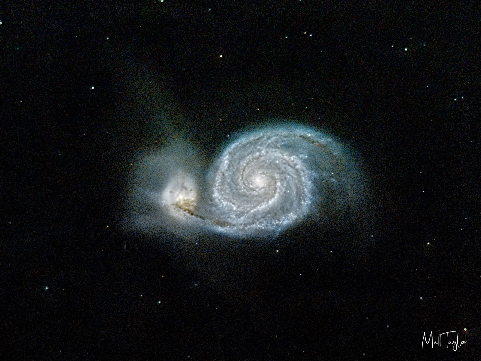 The Whirlpool Galaxy (M51), a spiral galaxy interacting with its smaller companion galaxy